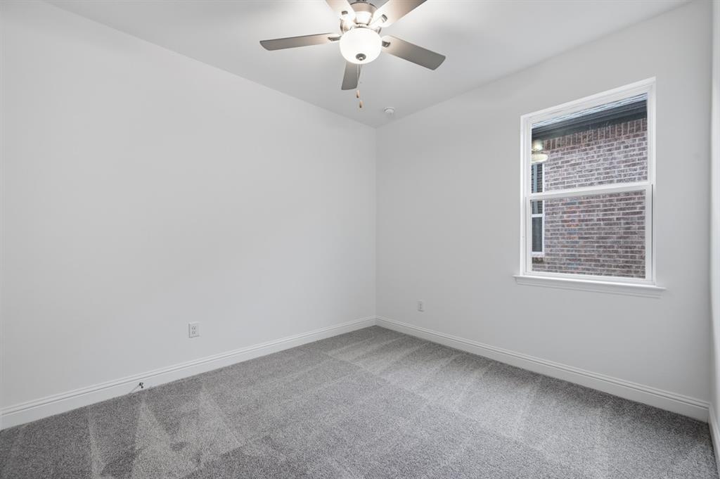 1604 Victory Circle Justin, TX 76247 - Photo 16 of 40 an empty room with a window