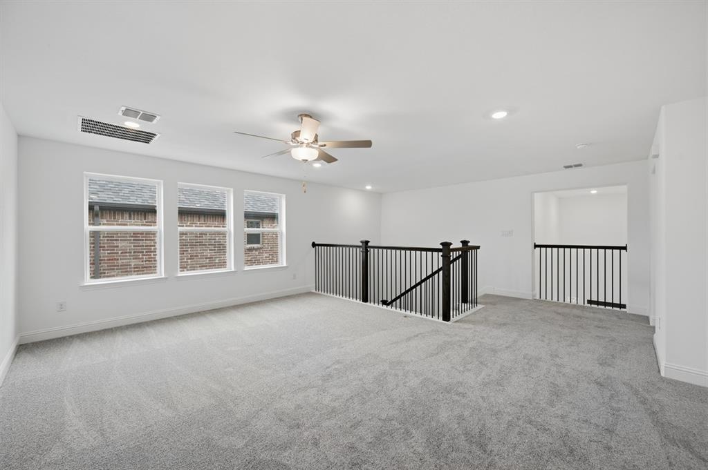 1604 Victory Circle Justin, TX 76247 - Photo 26 of 40 a view of an empty room with windows