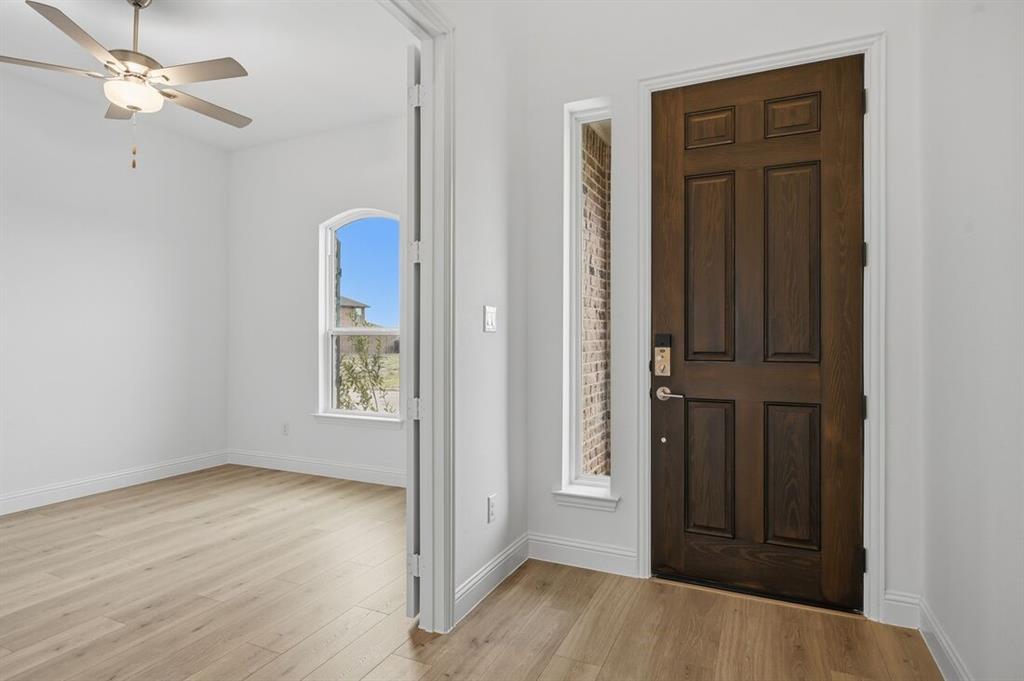 1604 Victory Circle Justin, TX 76247 - Photo 28 of 40 an empty room with windows and closet