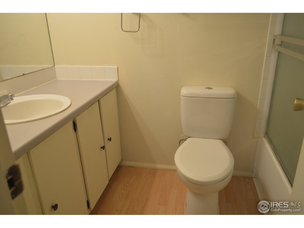 2707 Valmont Road, Unit 202B Boulder, CO 80304 - Photo 5 of 15 a bathroom with a granite countertop toilet and a sink