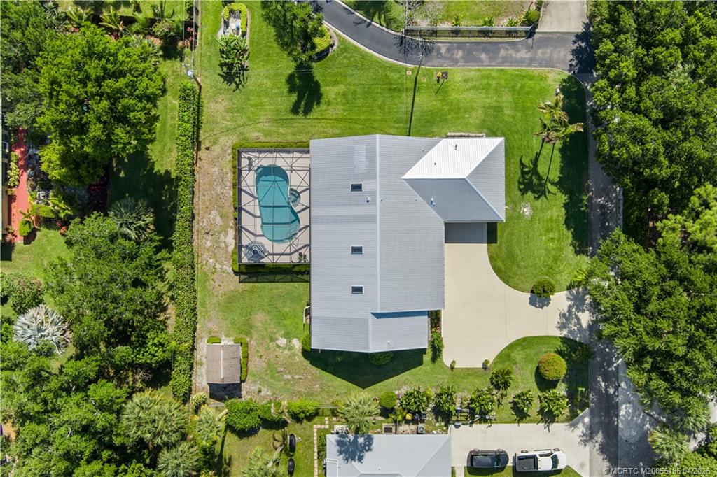 4620 Southeast Quail Trail Stuart, FL 34997 - Photo 57 of 71 an aerial view of a house with a garden