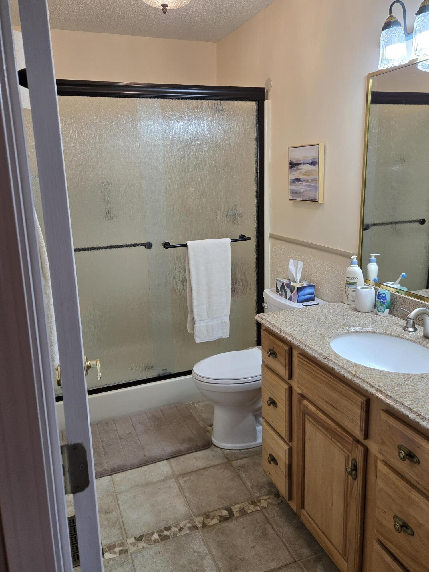 8441 Toestring Valley Road Spring City, TN 37381 - Photo 11 of 39 a bathroom with a granite countertop sink toilet and shower