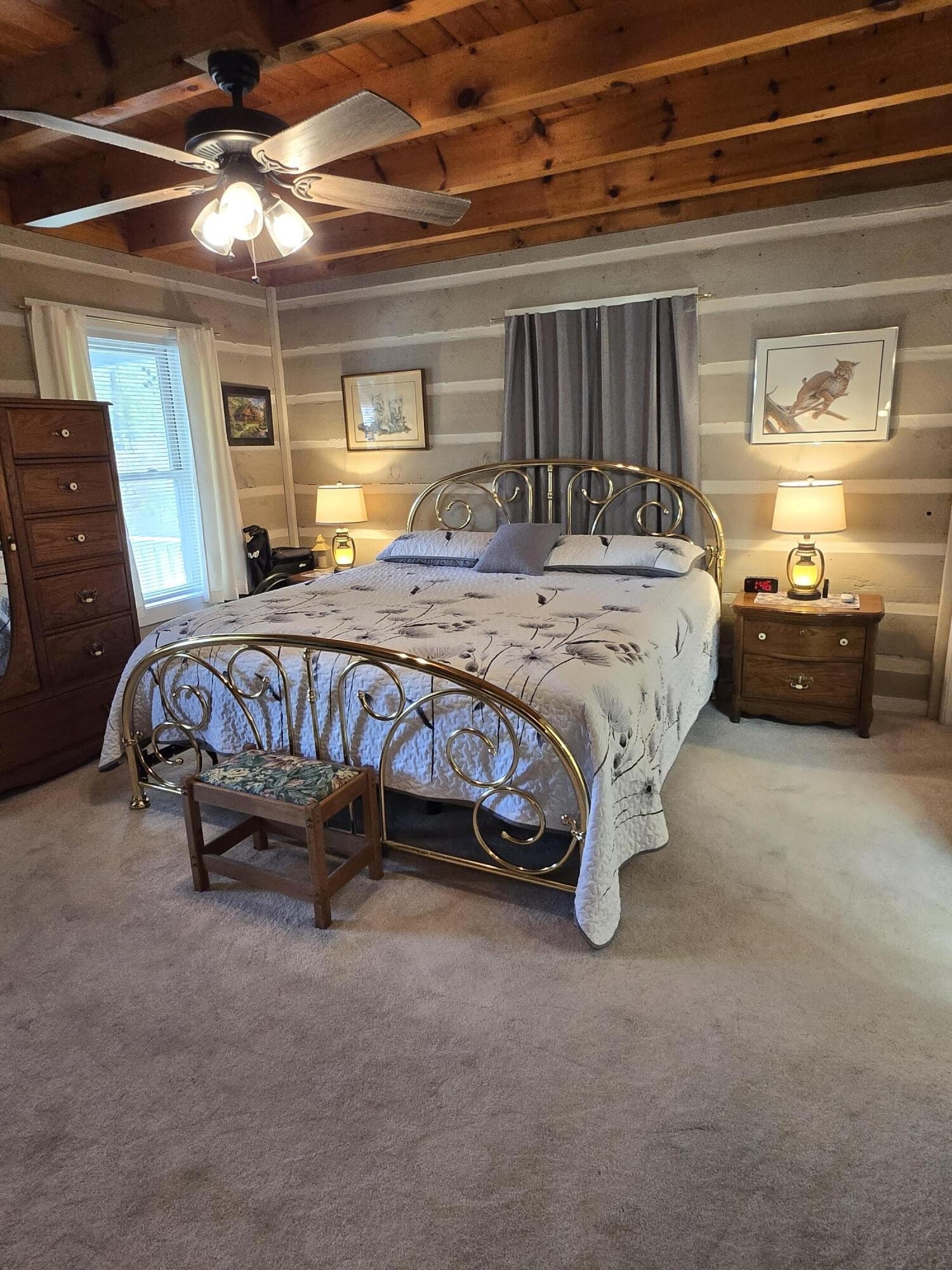 8441 Toestring Valley Road Spring City, TN 37381 - Photo 12 of 39 a bed sitting in a bedroom next to a window