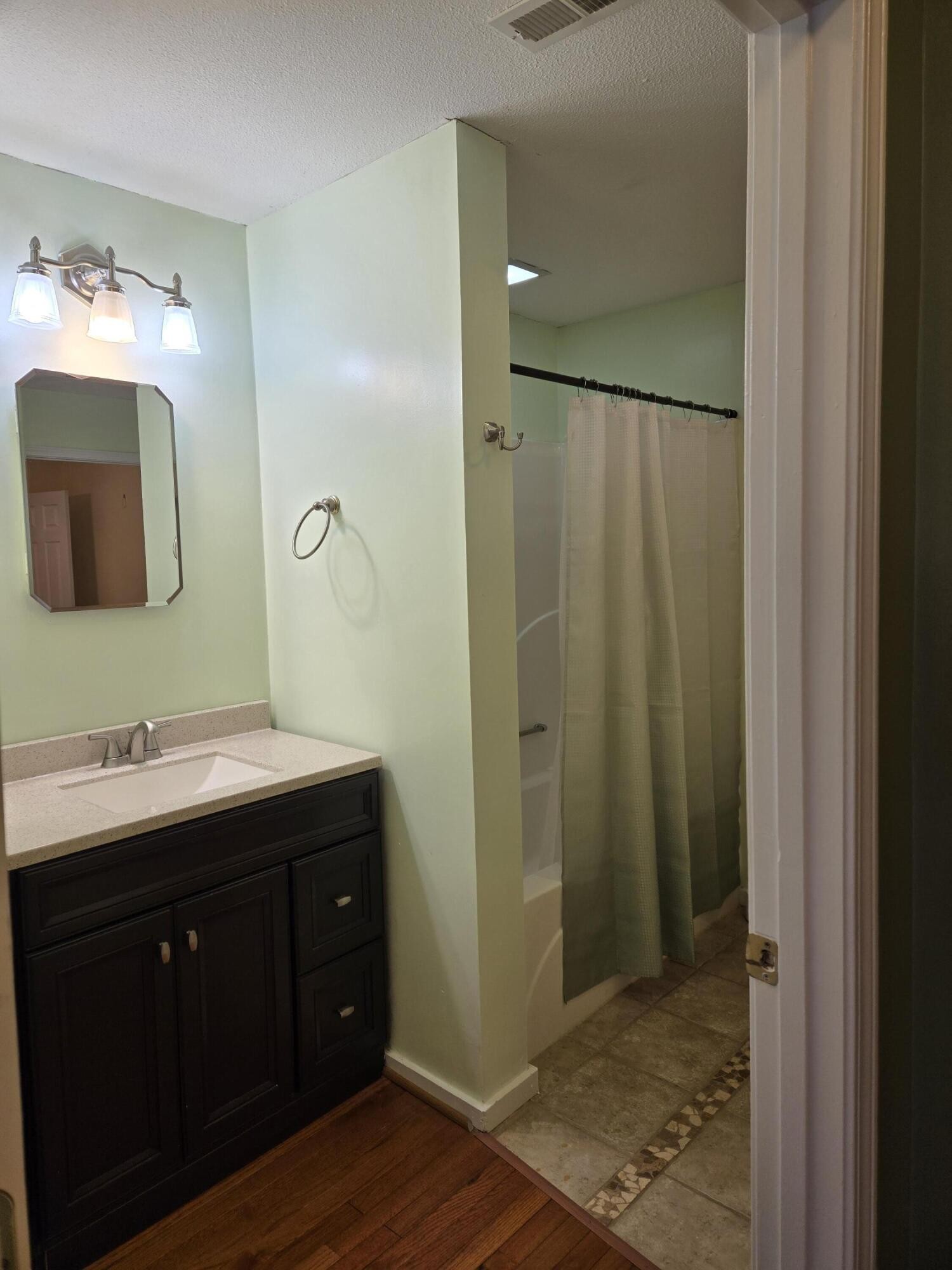 8441 Toestring Valley Road Spring City, TN 37381 - Photo 18 of 39 a bathroom with a double vanity sink and mirror