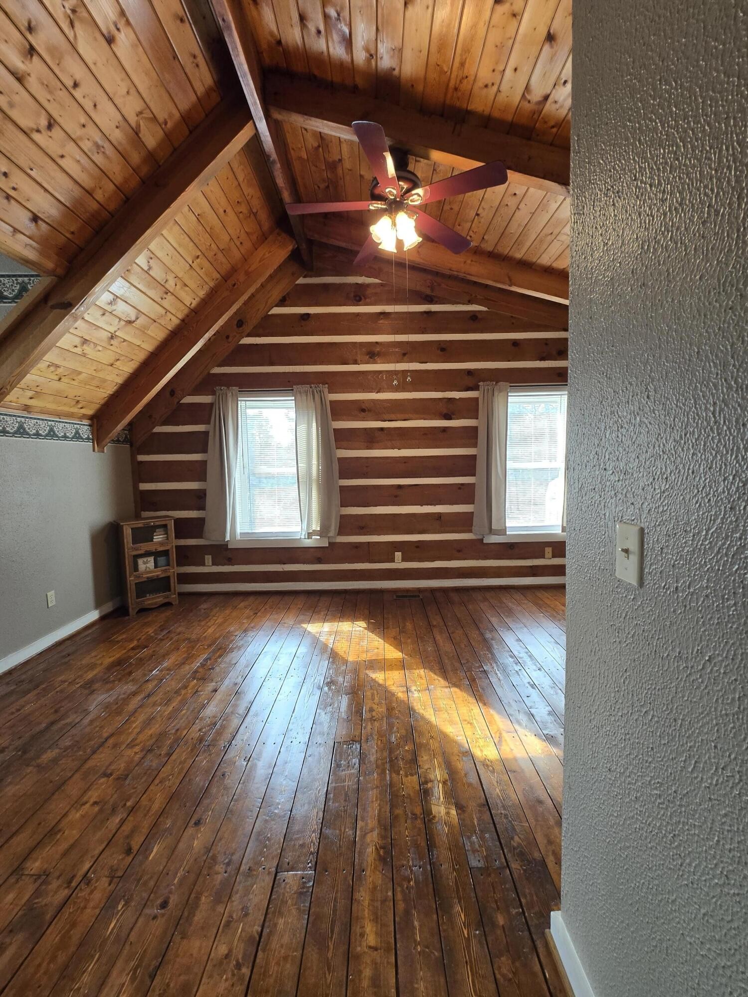 8441 Toestring Valley Road Spring City, TN 37381 - Photo 26 of 39 a view of a room with wooden floors and stairs