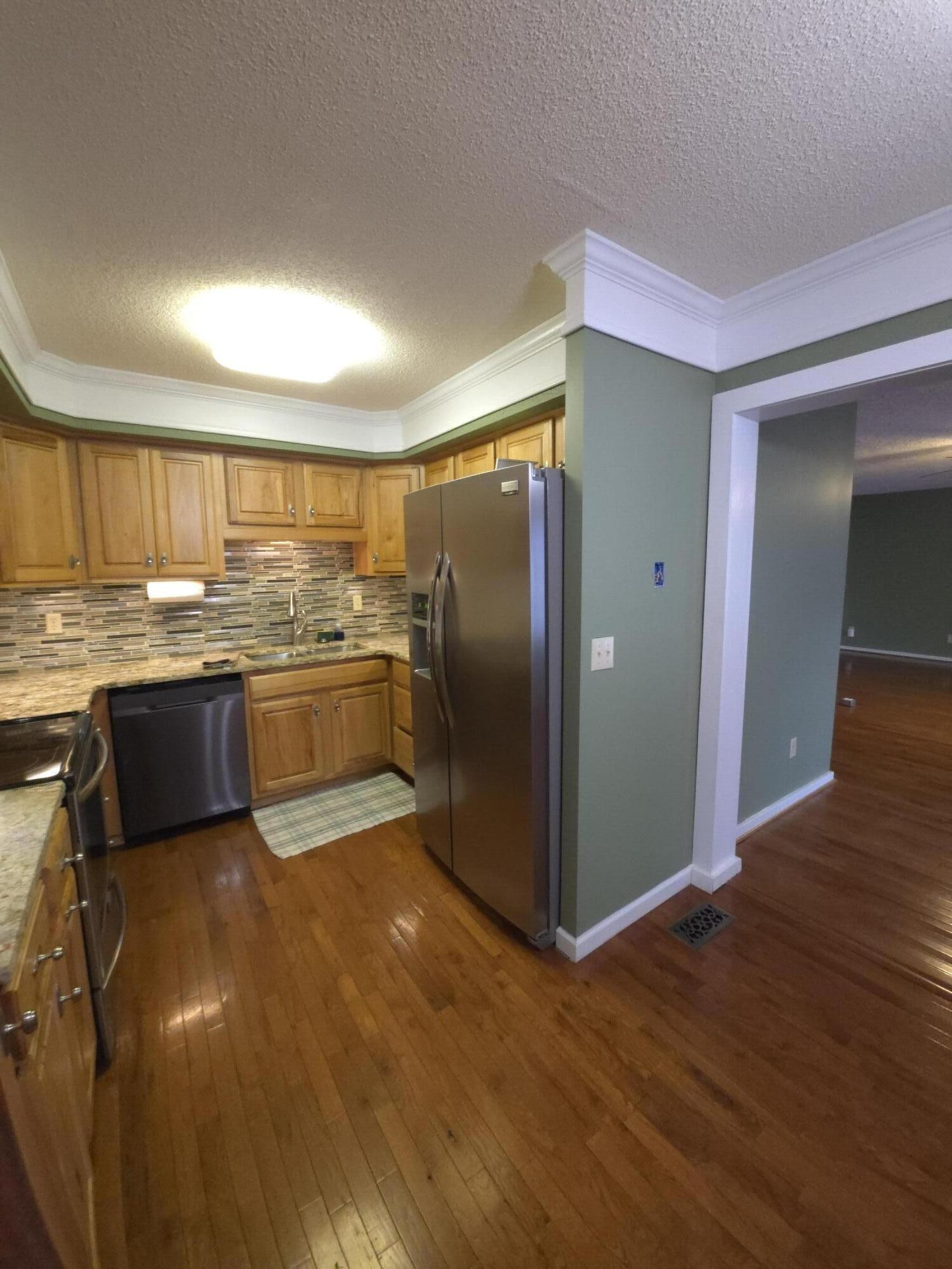 8441 Toestring Valley Road Spring City, TN 37381 - Photo 8 of 39 a kitchen with stainless steel appliances granite countertop a stove a sink and a refrigerator