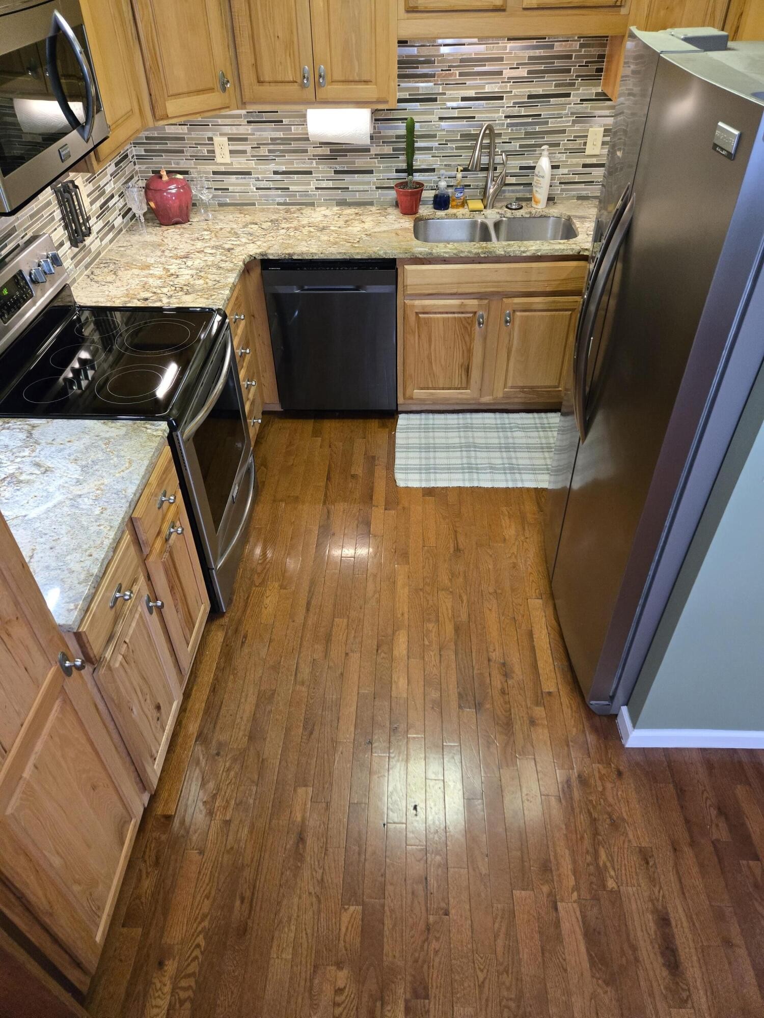 8441 Toestring Valley Road Spring City, TN 37381 - Photo 9 of 39 a kitchen with kitchen island granite countertop a sink and wooden floor