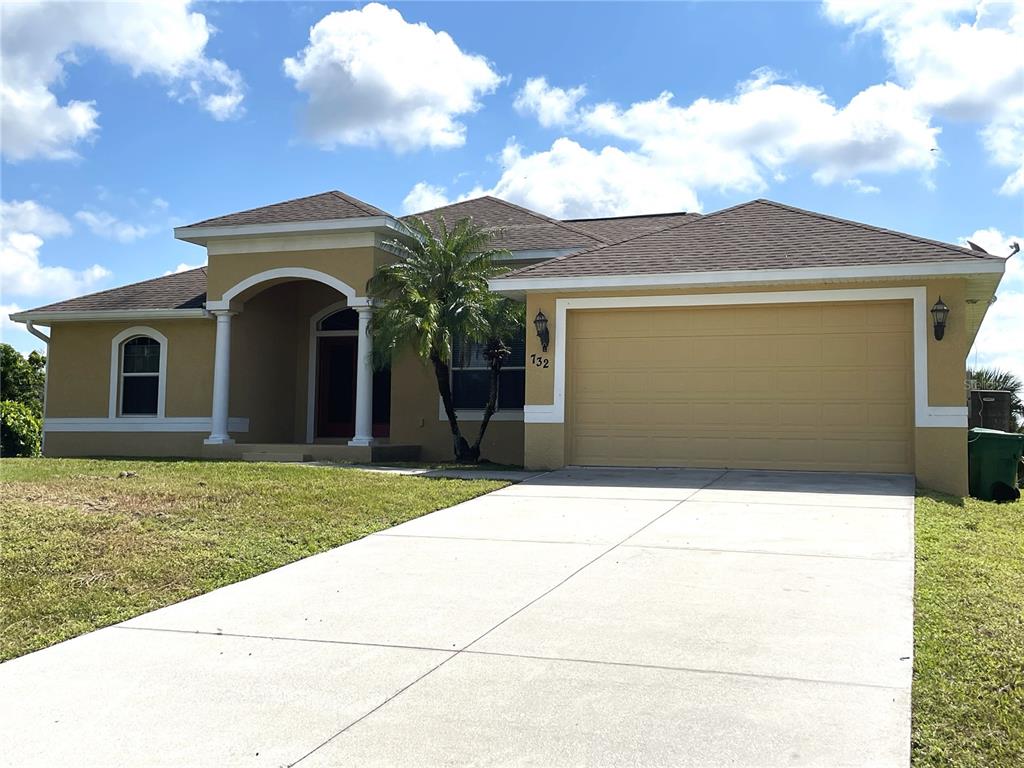 732 Bowman Terrace Port Charlotte, FL 33953 - Photo 1 of 14 a front view of a house with garden