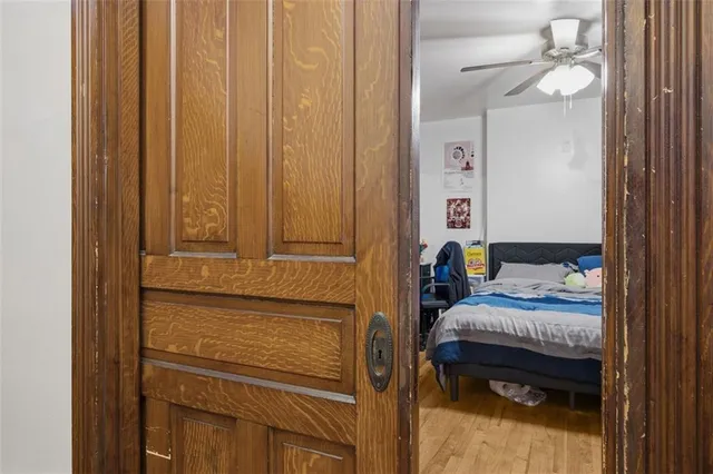 a bed room with bed and a window