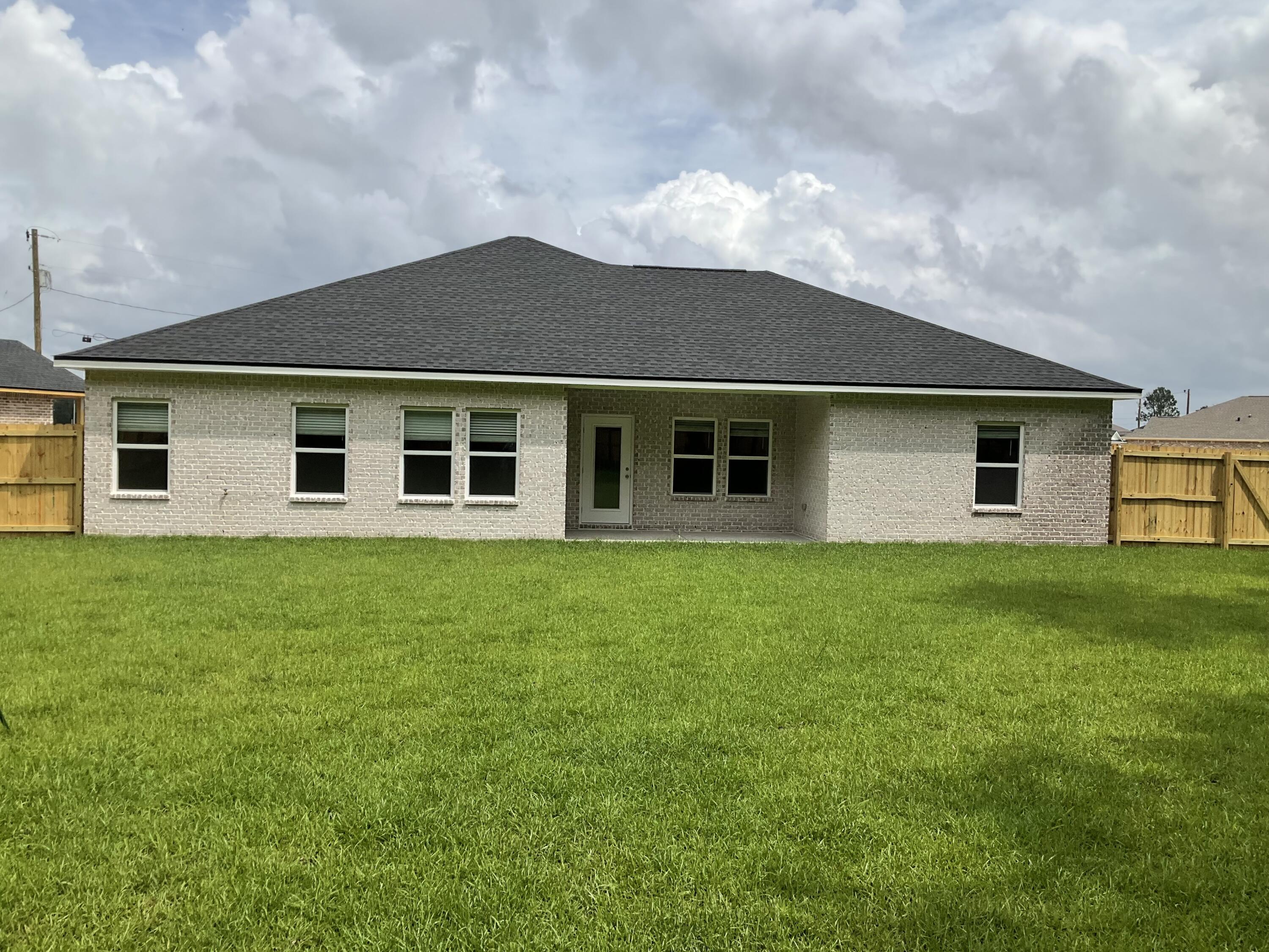 6120 Mildreds Way Crestview, FL 32539 - Photo 2 of 22 a view of a house with a backyard