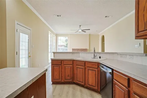 a kitchen with a sink and cabinets