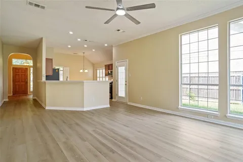 a view of a kitchen with a sink and a window