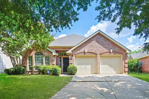 front view of a house and a yard