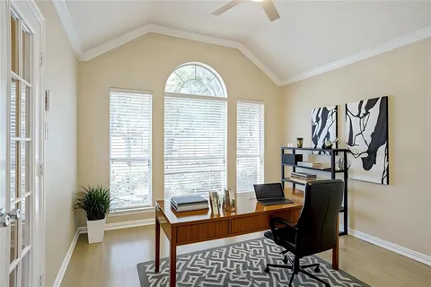a view of a livingroom with furniture and a window
