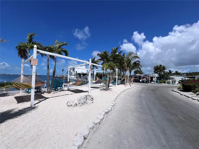 a view of a street with cars