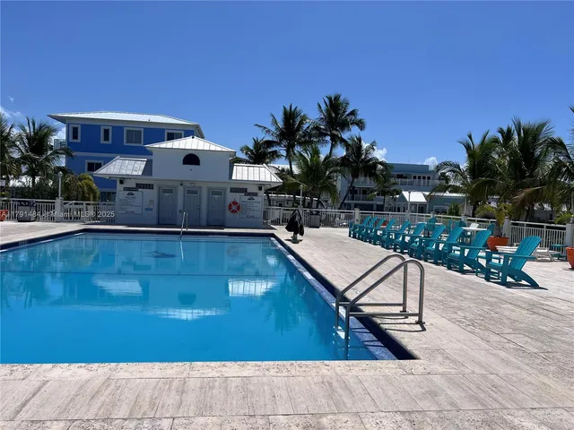 a view of a swimming pool with a lounge chairs
