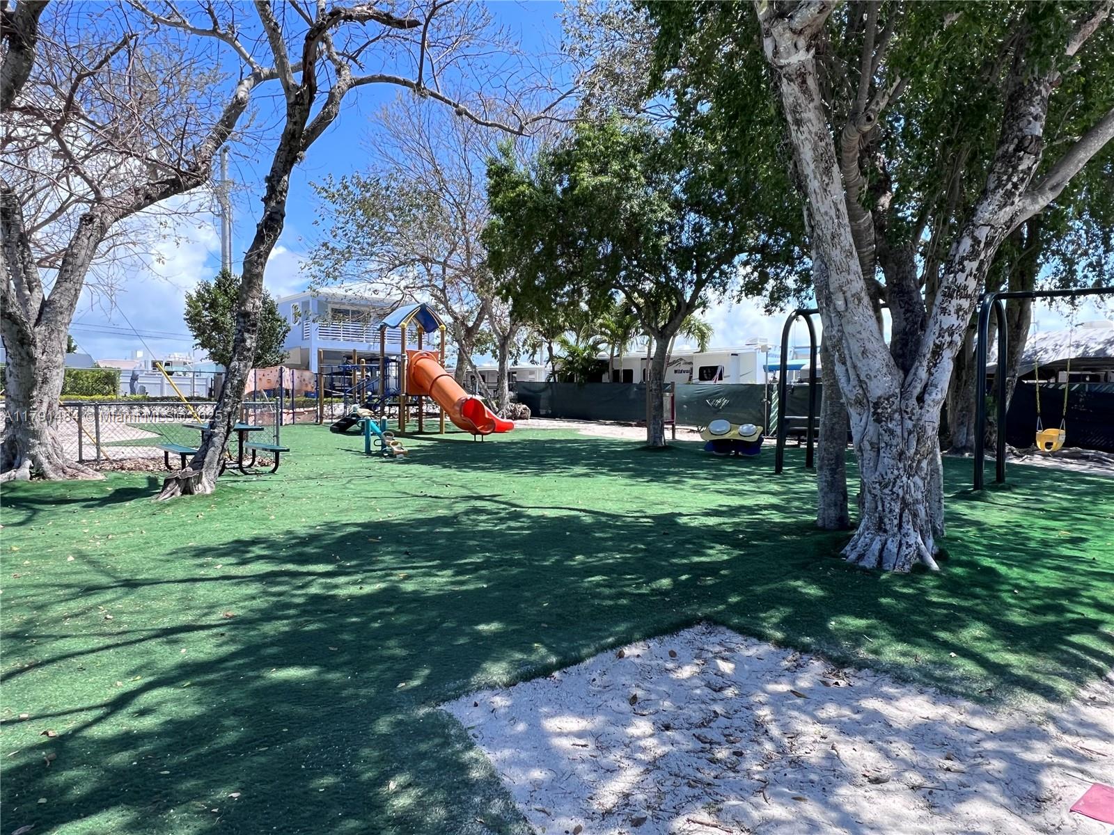 325 Calusa Street, Unit 5 Key Largo, FL 33037 - Photo 20 of 21 a view of a park with large trees