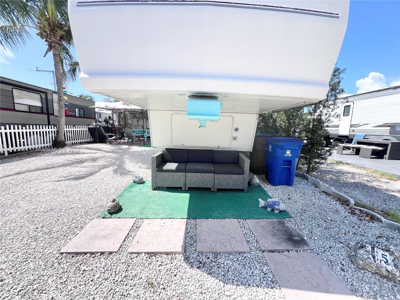 325 Calusa Street, Unit 5 Key Largo, FL 33037 - Photo 10 of 21 a view of a porch and yard