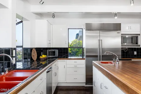 a kitchen with a sink and refrigerator