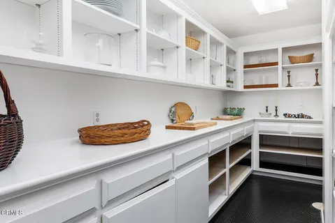 a kitchen with a stove and cabinets