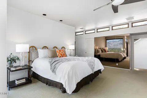 a bedroom with bed and window