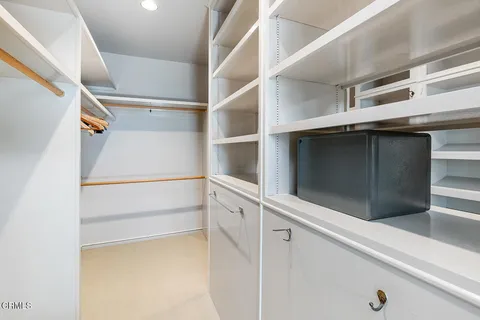 a view of an empty walk in closet