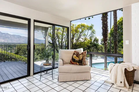 a outdoor living space with furniture and a potted plant