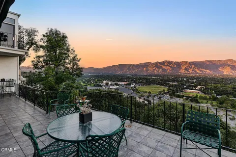 a view of a patio in a backyard
