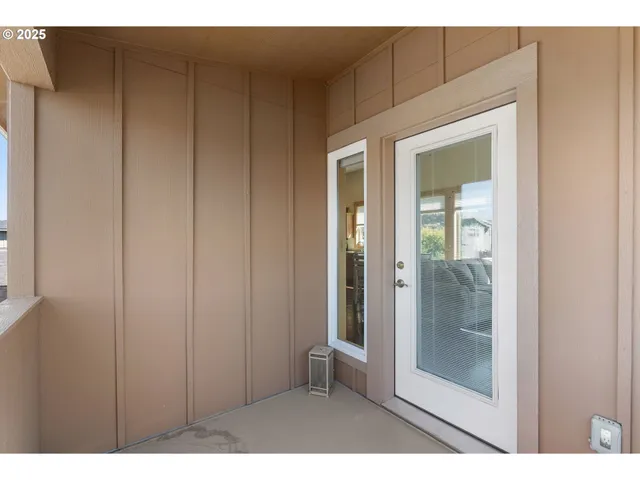 a view of an empty room with glass door