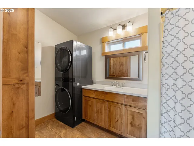 a bathroom with a sink mirror and vanity
