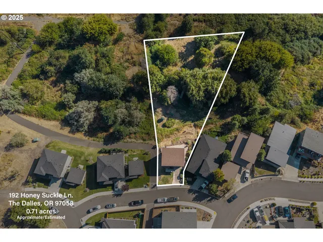 a view of outdoor space with trees all around