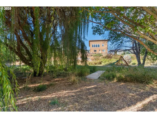 a view of balcony with wooden floor