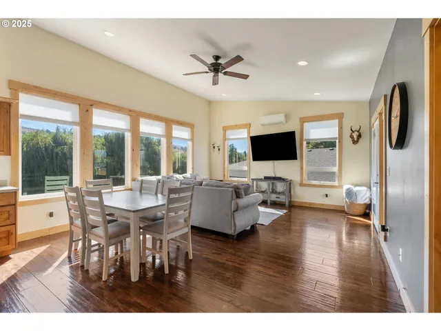 a view of a dining room with furniture window and wooden floor