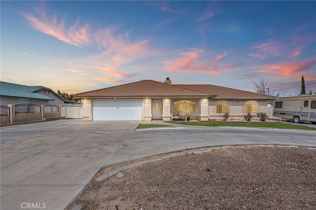 19084 Rock Springs Road Hesperia, CA 92345 - Photo 1 of 44 a front view of a house with a yard