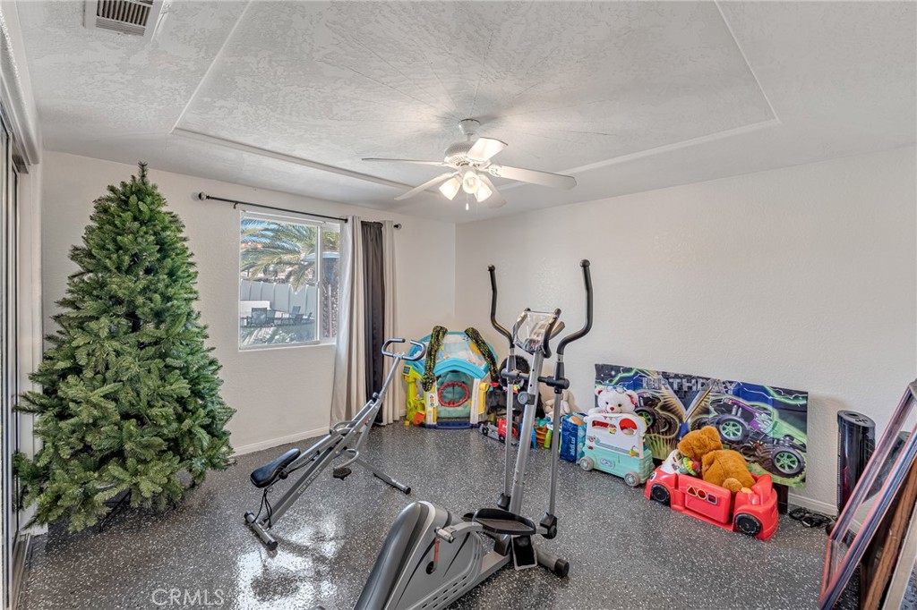 19084 Rock Springs Road Hesperia, CA 92345 - Photo 18 of 44 a view of a room with gym equipment