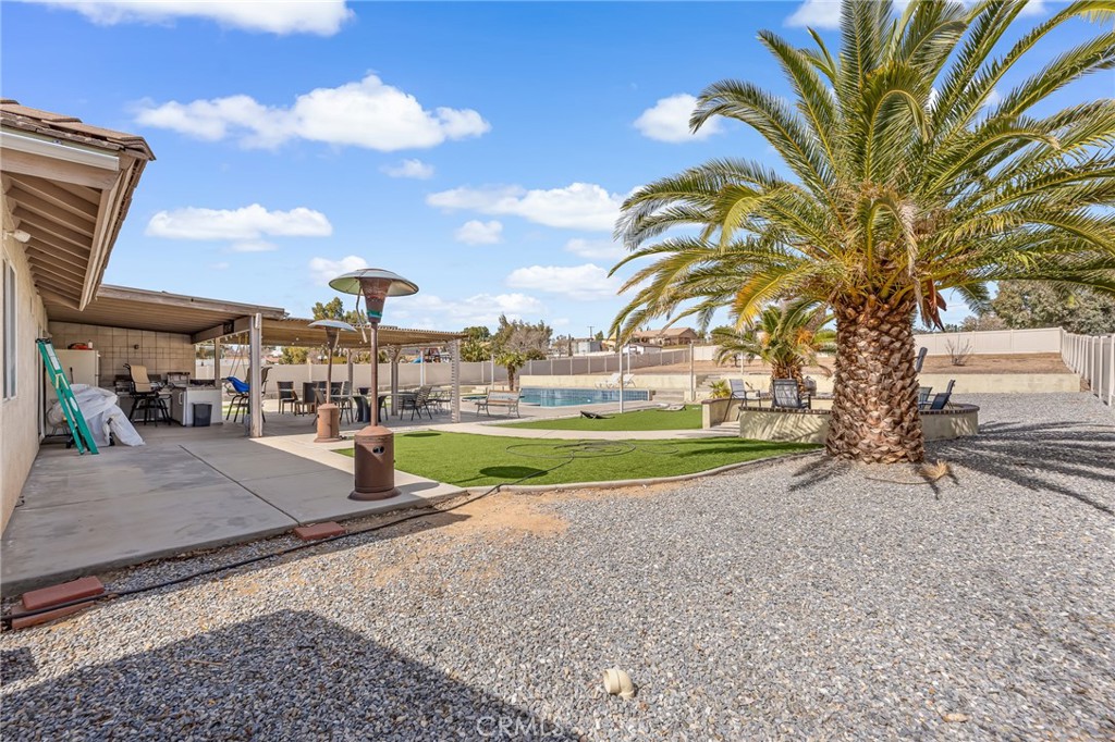 19084 Rock Springs Road Hesperia, CA 92345 - Photo 22 of 44 a view of a park with swings and slides