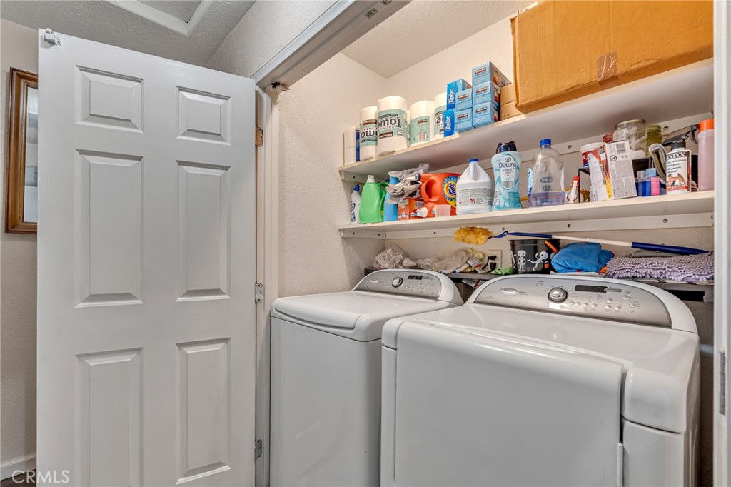 19084 Rock Springs Road Hesperia, CA 92345 - Photo 24 of 44 a utility room with dryer and washer