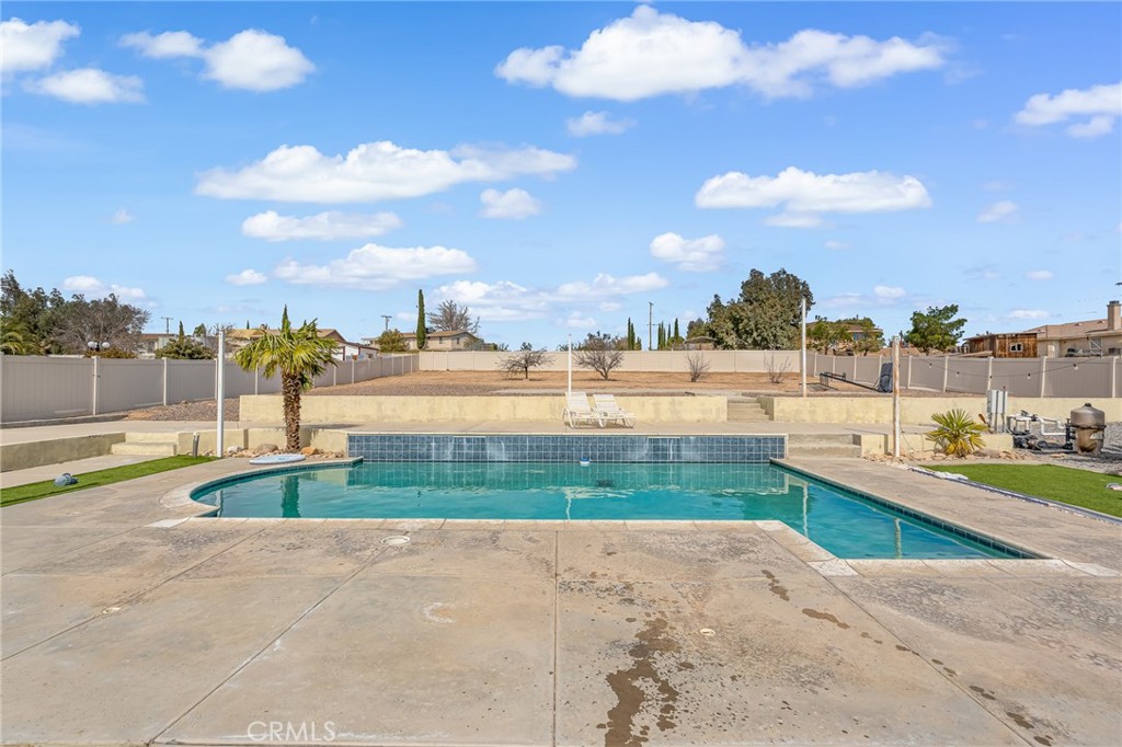 19084 Rock Springs Road Hesperia, CA 92345 - Photo 26 of 44 a view of an swimming pool and outdoor space