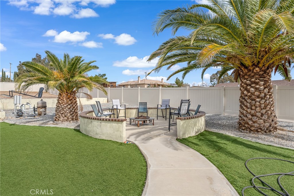 19084 Rock Springs Road Hesperia, CA 92345 - Photo 29 of 44 a view of a swimming pool and lounge chairs