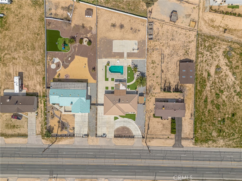 19084 Rock Springs Road Hesperia, CA 92345 - Photo 40 of 44 an aerial view of a house with a garden and shower