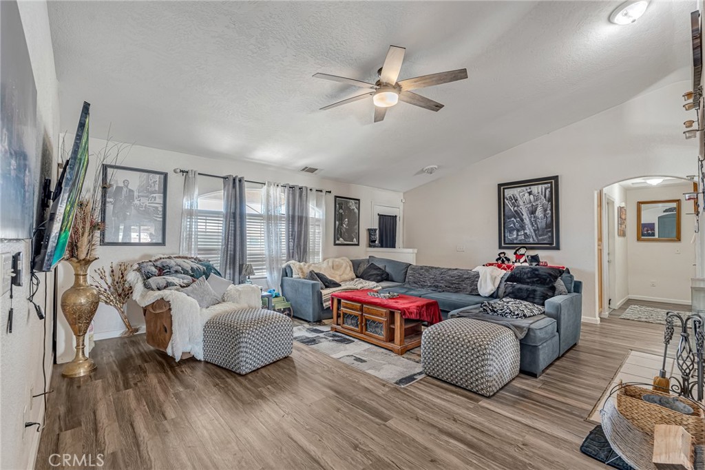 19084 Rock Springs Road Hesperia, CA 92345 - Photo 7 of 44 a living room with furniture and a large window