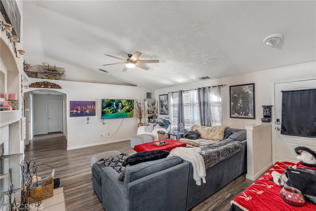19084 Rock Springs Road Hesperia, CA 92345 - Photo 9 of 44 a living room with furniture and a flat screen tv