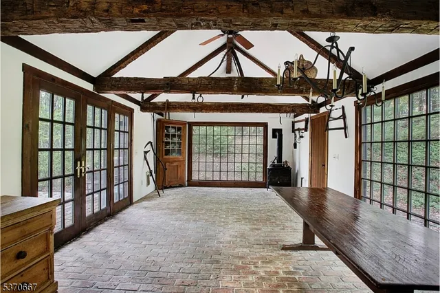 a view of backyard with a tub and wooden floor