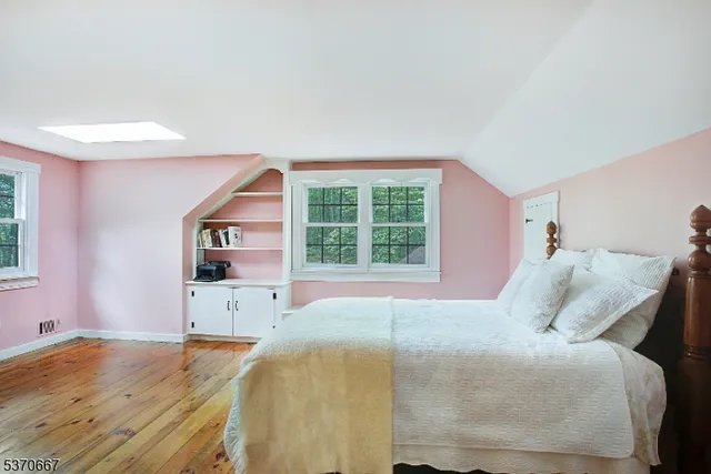 a bed room with a bed and a window