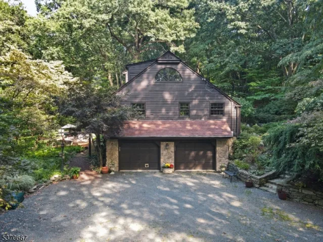 a view of a yard with plants and trees