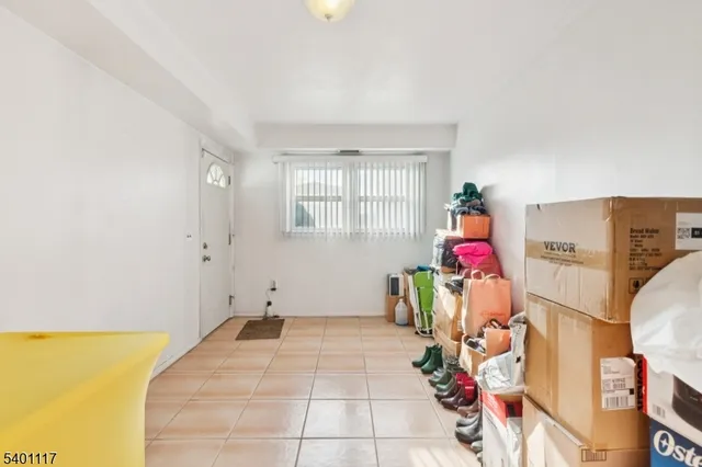 a view of a room with toys and dresser