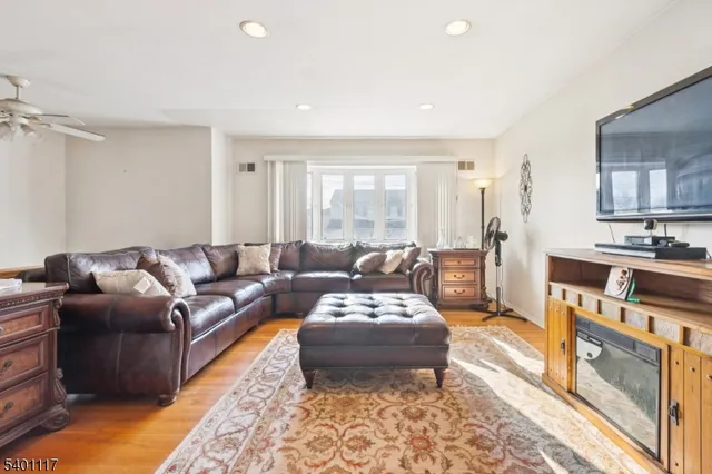 a living room with furniture and a rug