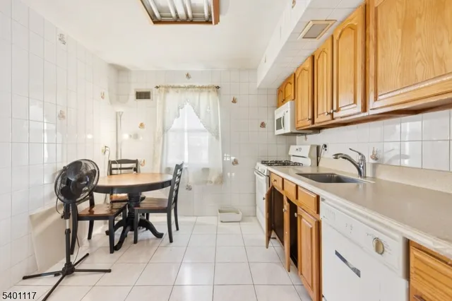 a kitchen with sink and cabinets