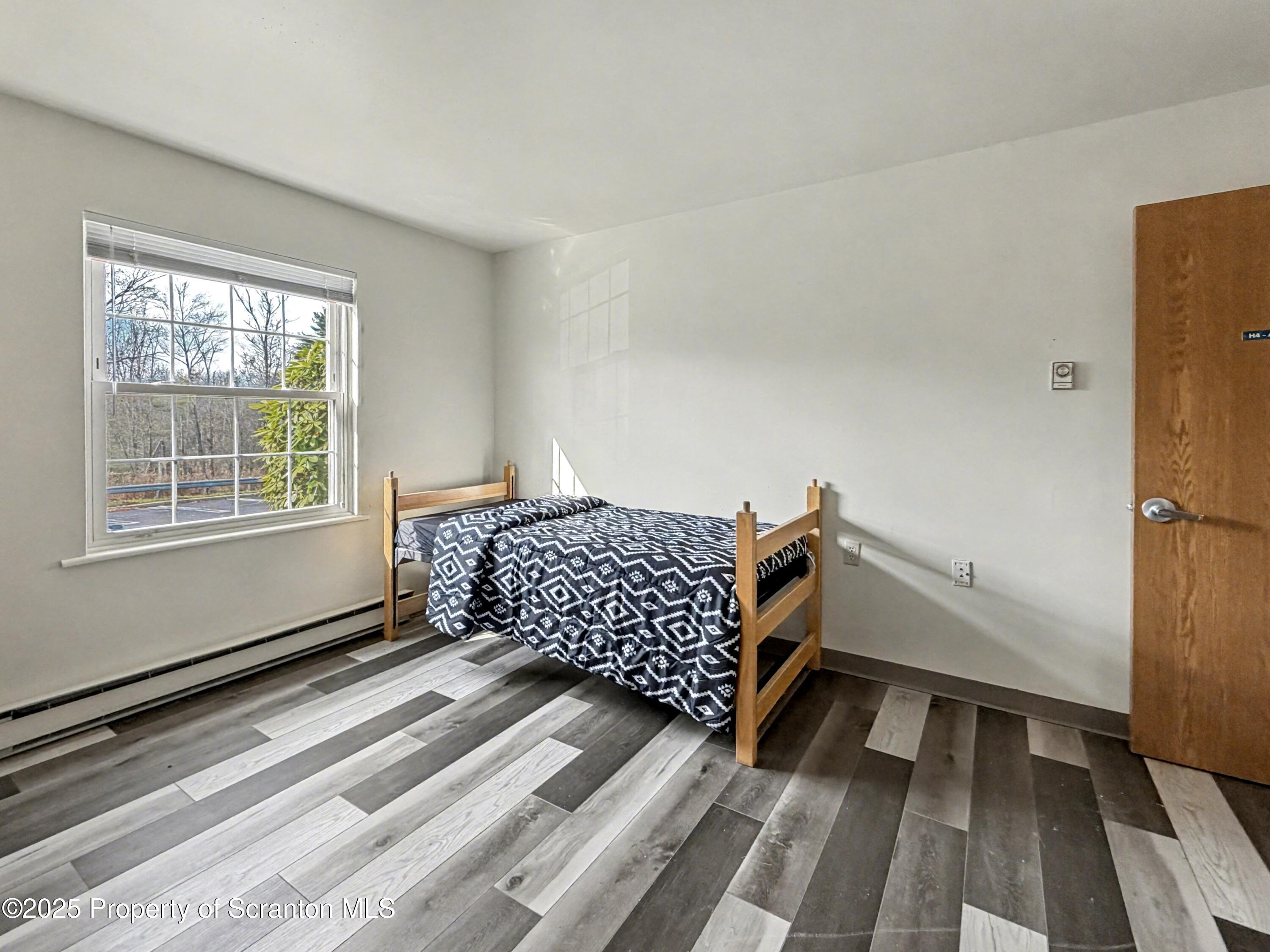 42 Nittany Drive, Unit HEMLOCK 4 Dallas, PA 18612 - Photo 12 of 13 a bedroom with a bed and a window