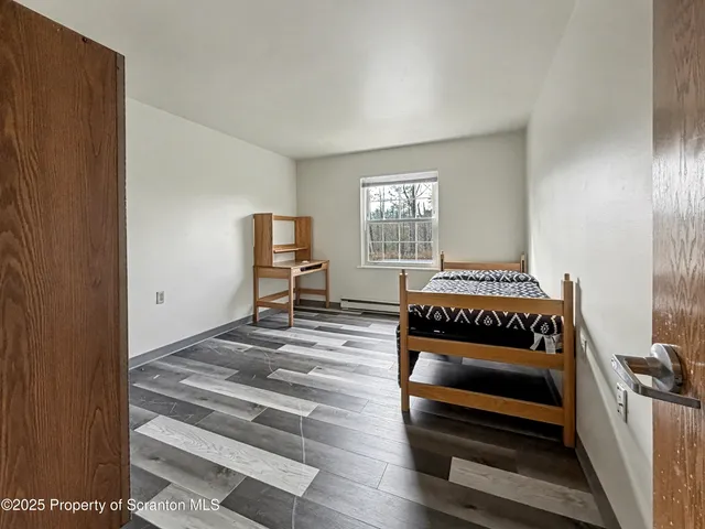 a bedroom with furniture and window